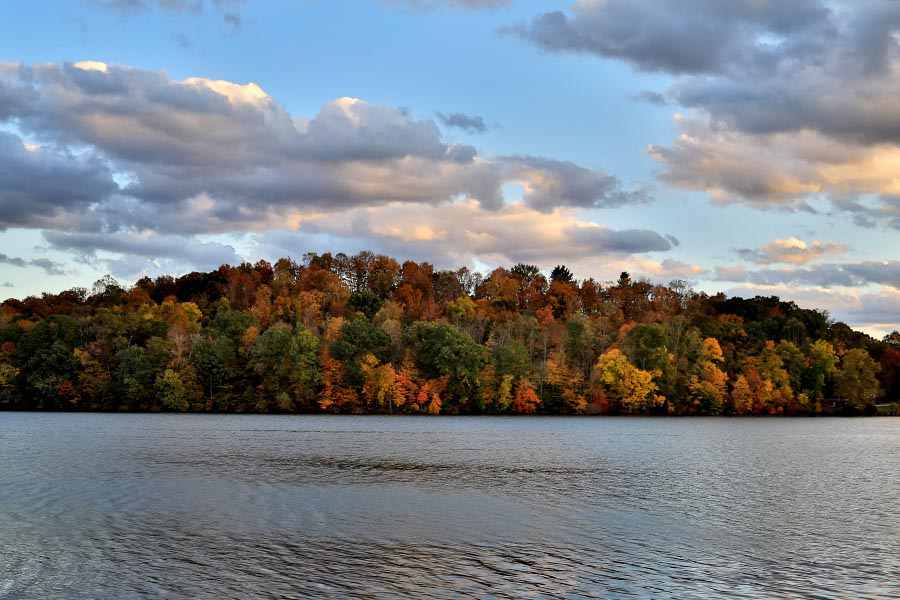 Logan, OH Insurance - Lake Logan, Ohio in Autumn, Trees Turning Orange and Red Over the Large Blue Lake